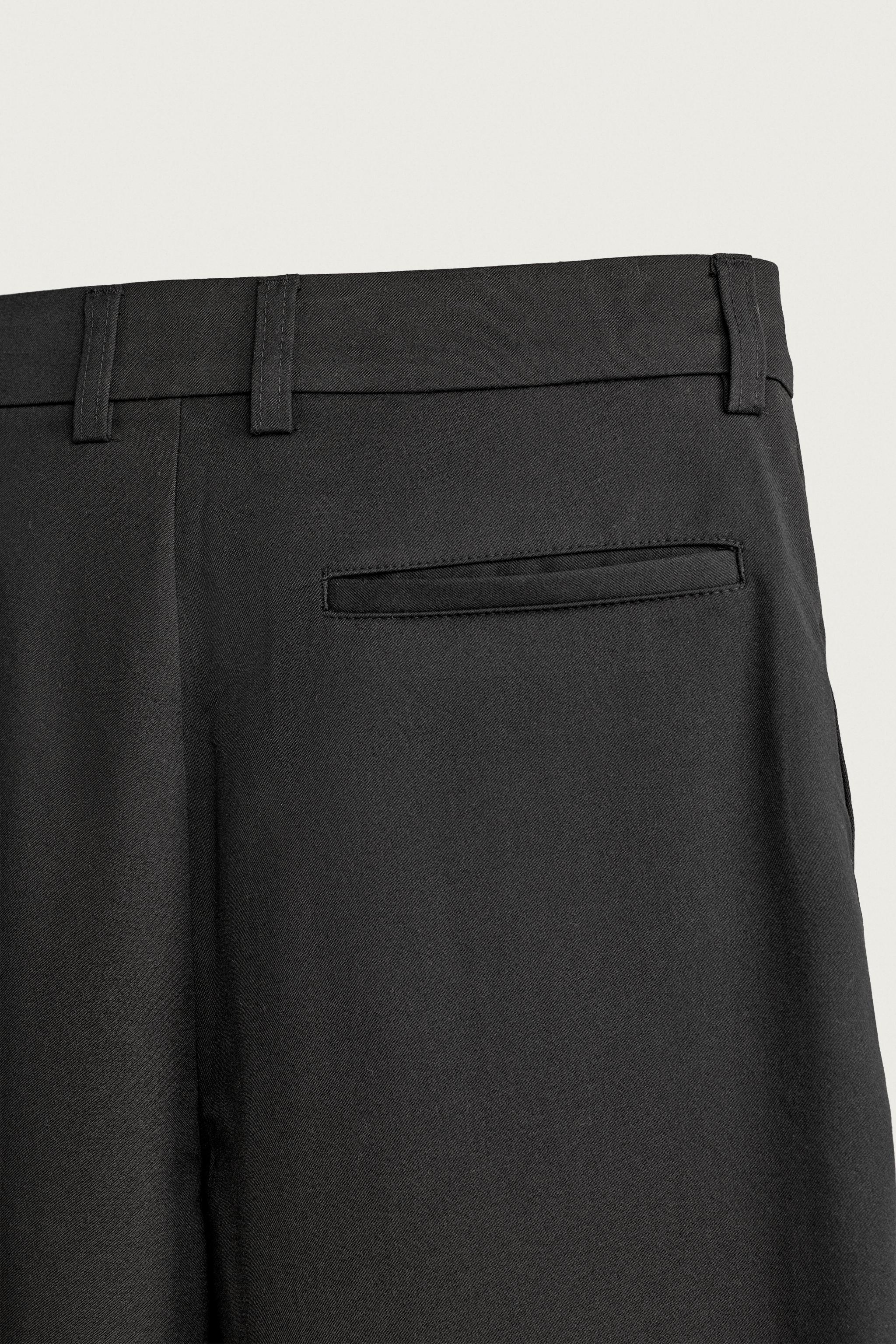 PLEATED RELAXED-FIT PANTS